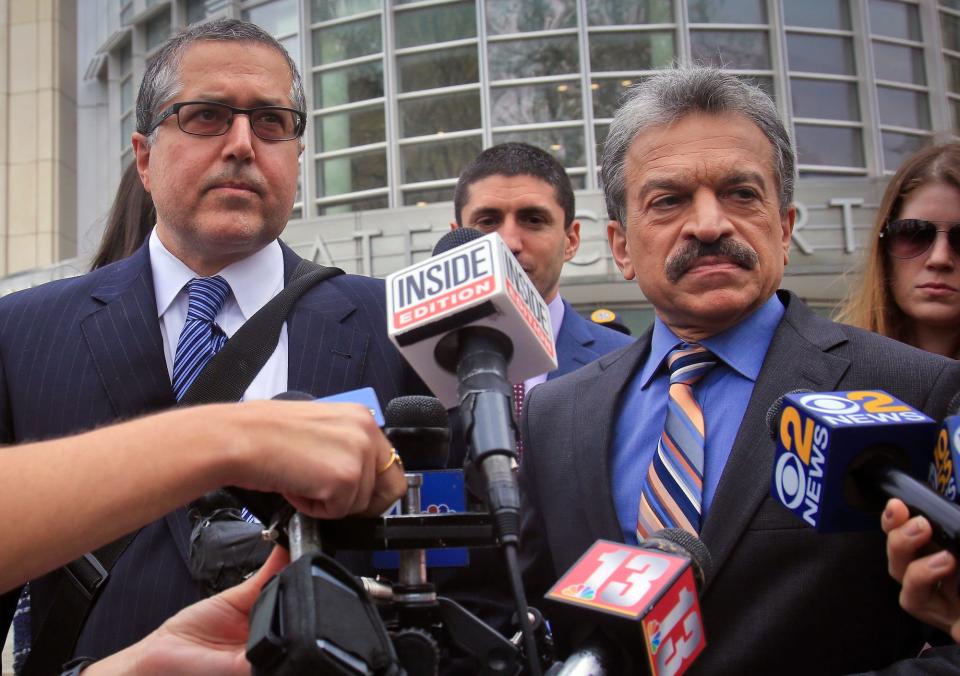 Attorneys representing NXIVM leader Keith Raniere in a sex trafficking case, Mark Agnifilo, second from left, and Paul DerOhannesian, second from right, prepare to hold a news briefing outside Brooklyn Federal Court.