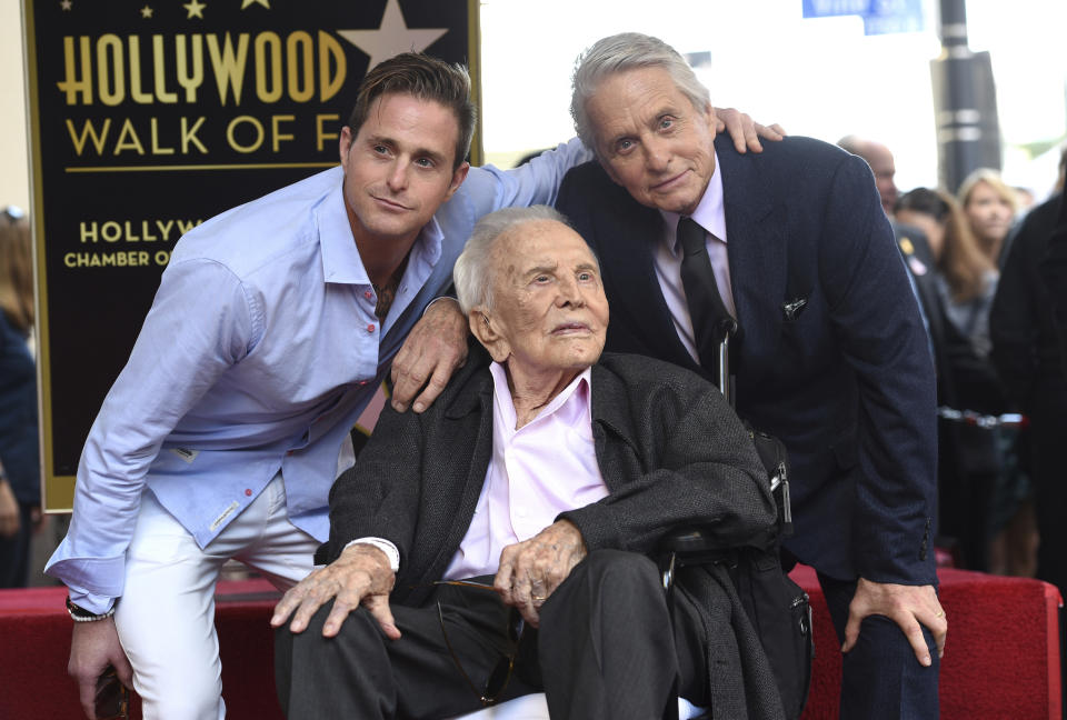 Honoree and actor Michael Douglas, from right, poses with his father actor Kirk Douglas and his son actor Cameron Douglas following a ceremony honoring him with a star on the Hollywood Walk of Fame on Tuesday, Nov. 6, 2018, in Los Angeles. (Photo by Chris Pizzello/Invision/AP)