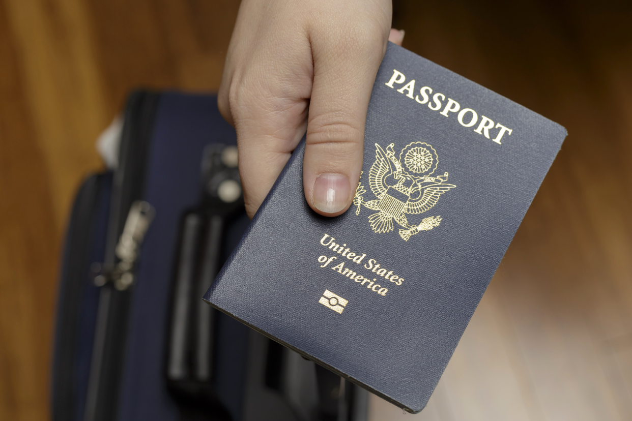 Hand holding U.S. passport 