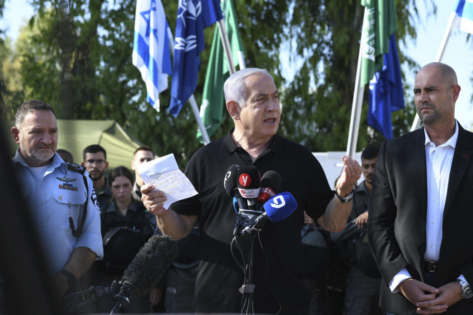 Israeli Prime Minister Benjamin Netanyahu meets with Israeli border police on Thursday, May 13, 2021 in Lod, near Tel Aviv after a wave of violence in the city the night before. Jewish and Arab mobs battled in the central city of Lod, the epicenter of the troubles, despite a state of emergency and nighttime curfew. (AP Photo/Yuval Chen, Yediot Ahronot, Pool)