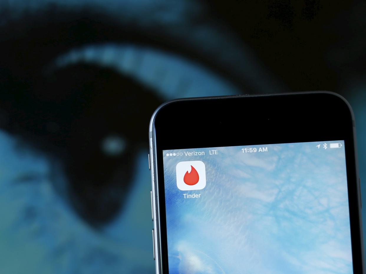 The dating app Tinder is shown on an Apple iPhone in this photo illustration taken February 10, 2016. Just in time for Valentine's Day, a survey shows that more Americans are looking for love through online dating, with more than four times as many young adults using mobile apps than in 2013. REUTERS/Mike Blake/Illustration