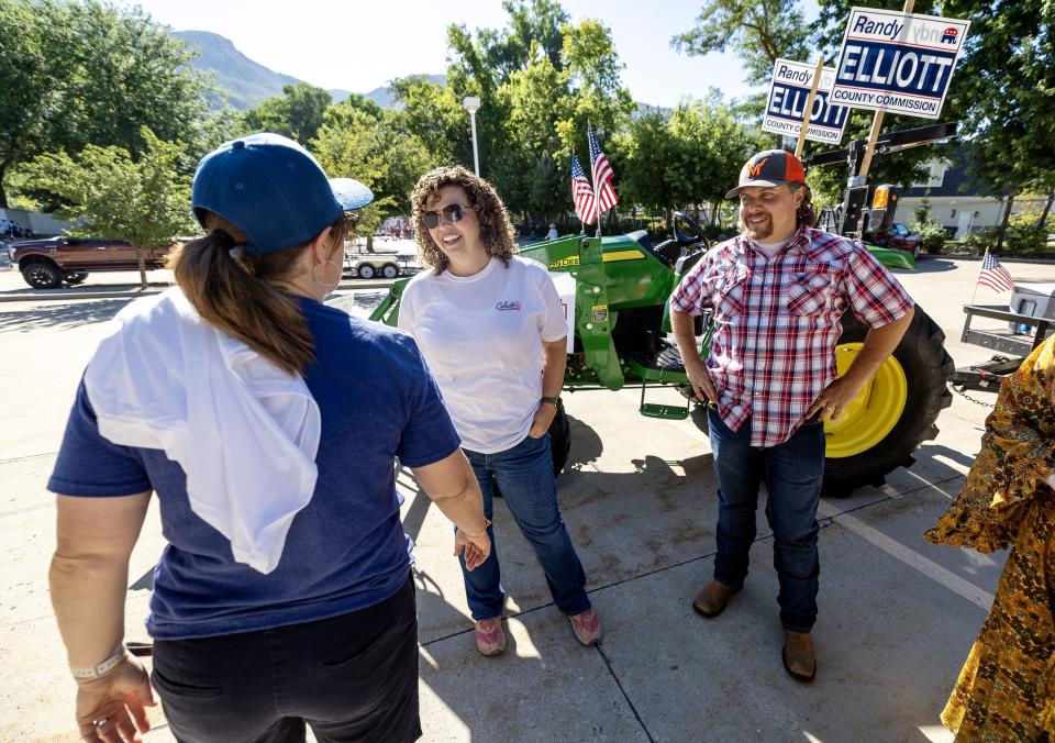 Celeste Maloy, congressional candidate, and Davis County Commissioner Randy Elliott talk with Maloy’s campaign manager, Rhonda Perkes, prior to participating in a parade in Farmington on Saturday, July 15, 2023. | Scott G Winterton, Deseret News