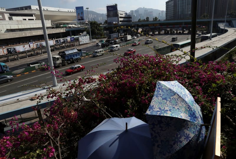 Cars drive past the toll booth area of the re-opened Cross-Harbor Tunnel in Hong Kong