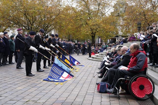 Standards are lowered during the service at the Cenotaph