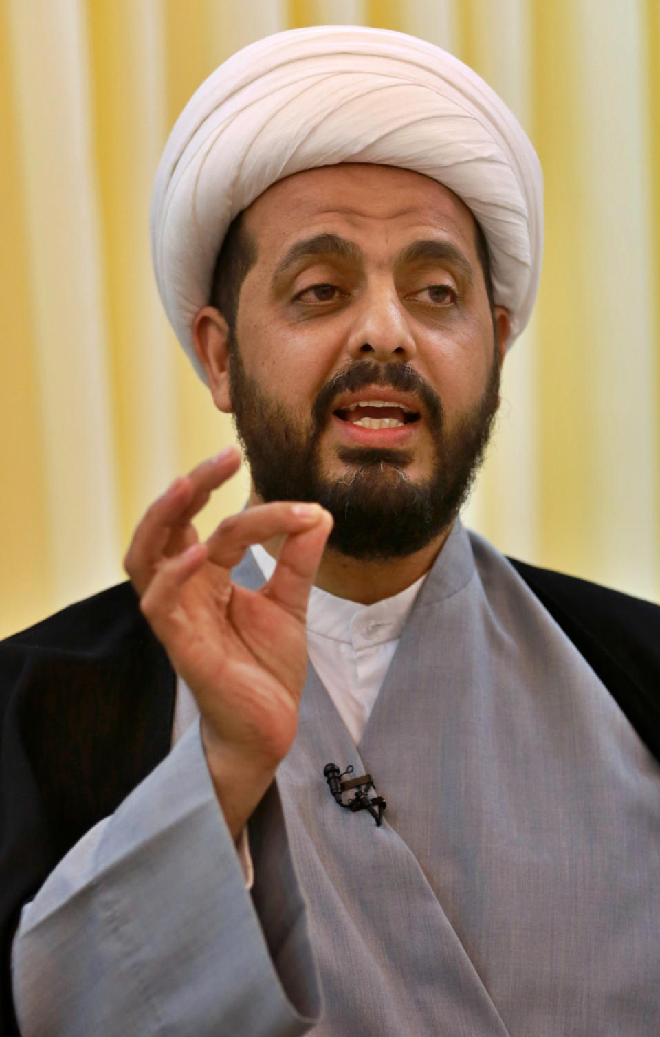 Qais al-Khazali, the leader of the militant Shiite group Asaib Ahl al-Haq, or League of the Righteous, speaks during an interview with The Associated Press in Baghdad, Iraq, Monday, Jan. 28, 2019. Al-Khazali said Monday that he expects a vote by the Iraqi parliament calling for the withdrawal of U.S. troops from the country within the next few months. Al-Khazali said there is no longer a justification for thousands of U.S. troops in the country after the Islamic State group has been defeated. (AP Photo/Khalid Mohammed)