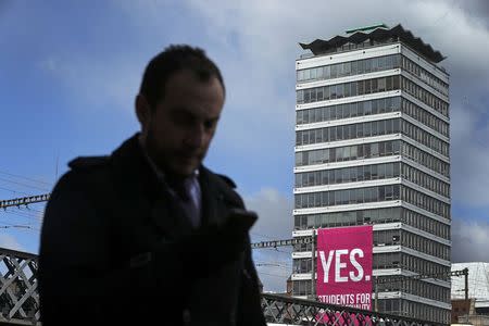 A large banner supporting a Yes vote hangs from a building in the Quays area of Dublin in Ireland May 19, 2015. REUTERS/Cathal McNaughton