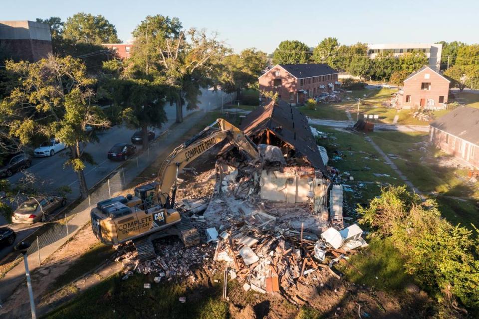 Crews demolish Allen Benedict Court Tuesday morning. The housing complex was built in 1940.