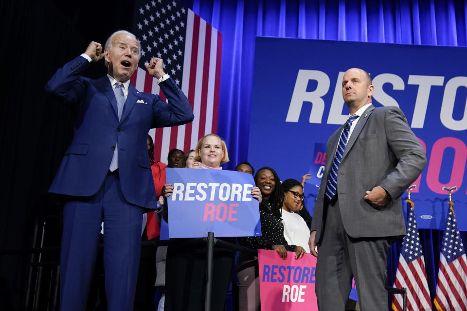 President Joe Biden cheers on stage after speaking about abortion access during a Democratic National Committee event at the Howard Theatre, Tuesday, Oct. 18, 2022, in Washington. (AP Photo/Evan Vucci)