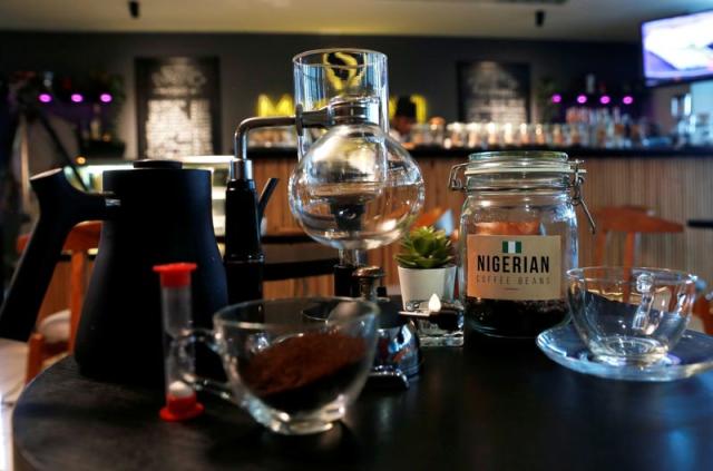 A jar of Nigerian coffee beans is pictured with a siphon brewing set at Mai Shayi cafe in Victoria Island, Lagos