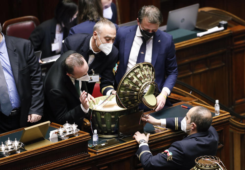 Ballots are counted in the Italian parliament in Rome, Thursday, Jan. 27, 2022. The first rounds of voting in Italy's Parliament for the country's next president yielded an avalanche of blank ballots, as lawmakers and special regional electors failed to deliver a winner amid a political stalemate. (Remo Casilli/Pool photo via AP)