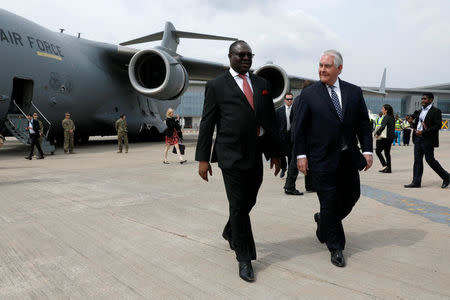 Nigeria's Ministry of Foreign Affairs, the Permanent Secretary Olukunle Bamgbose walks with U.S. Secretary of State Rex Tillerson as he arrives in Abuja, Nigeria, March 12, 2018. REUTERS/Jonathan Ernst