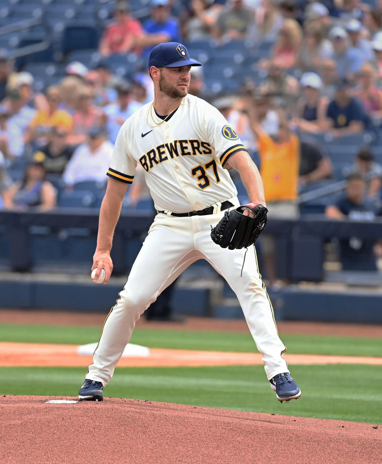 The Brewers' Adrian Houser pitches against the Seattle Mariners during a 2022 spring training game at American Family Fields of Phoenix.