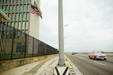 A vintage car drives past the U.S. Embassy in Havana, Cuba, June 19, 2017. REUTERS/Alexandre Meneghini