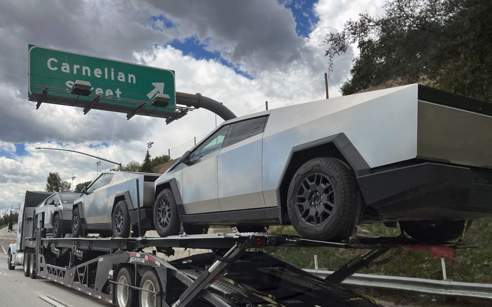 Three new Tesla Cybertrucks on a highway in Rancho Cucamonga, California