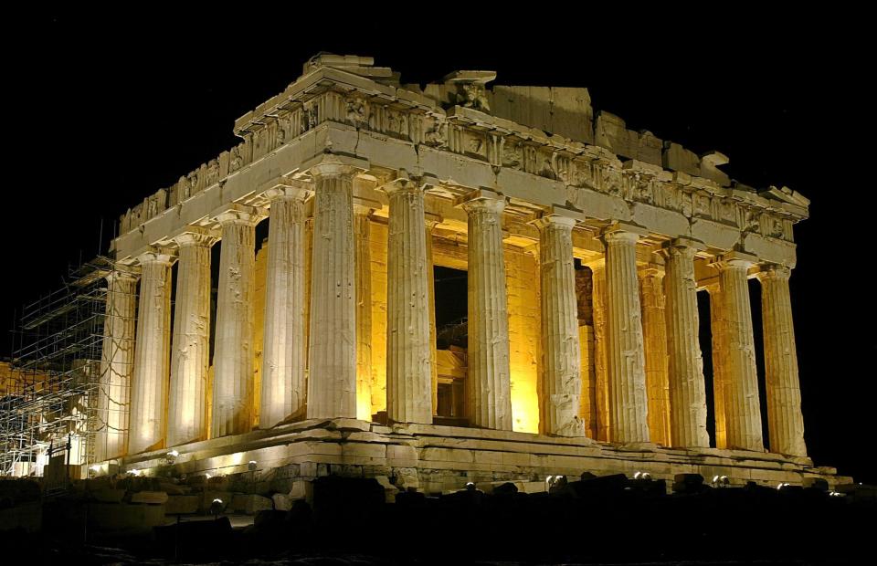 ATHENS - AUGUST 26:  The temple of Parthenon is pictured lit up at night atop the ancient Acropolis of Athens on August 26, during the 2004 Olympic Games in Athens, Greece. (Photo by Milos Bicanski/Getty Images)