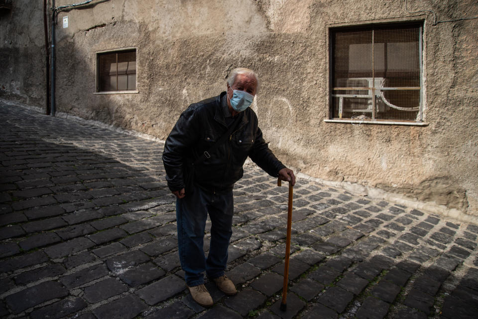 A man with a mask strolls in the old town on November 06, 2020 in Cosenza, Italy. (Photo by Ivan Romano/Getty Images)