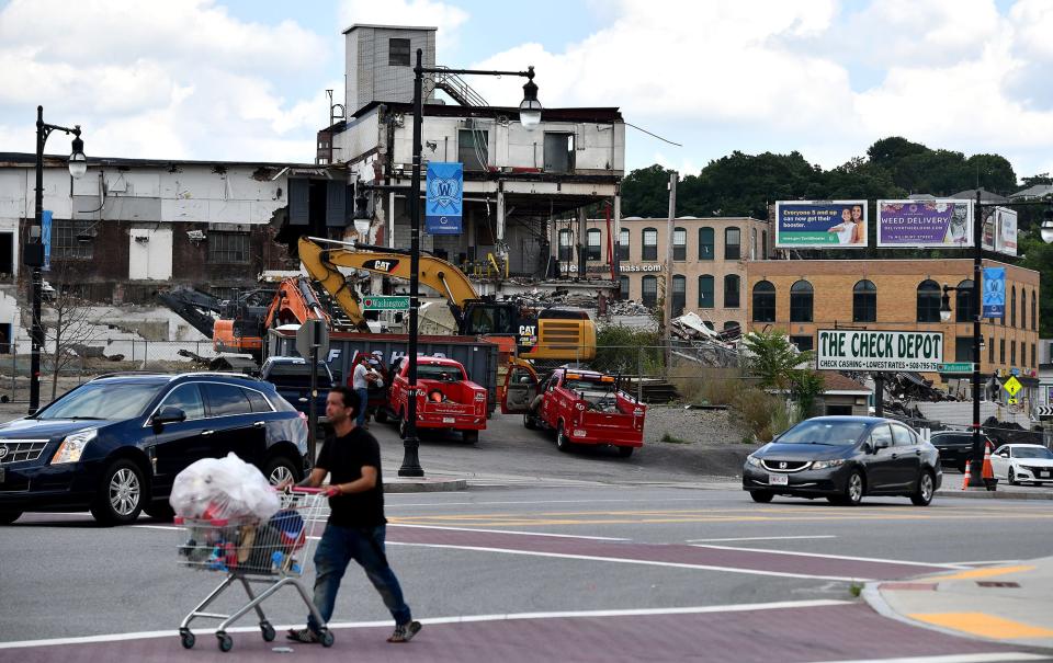 Buildings in the background at Kelley Square begin to emerge as demolition continues on the former Table Talk Pies building as seen from Madison and Washington streets.