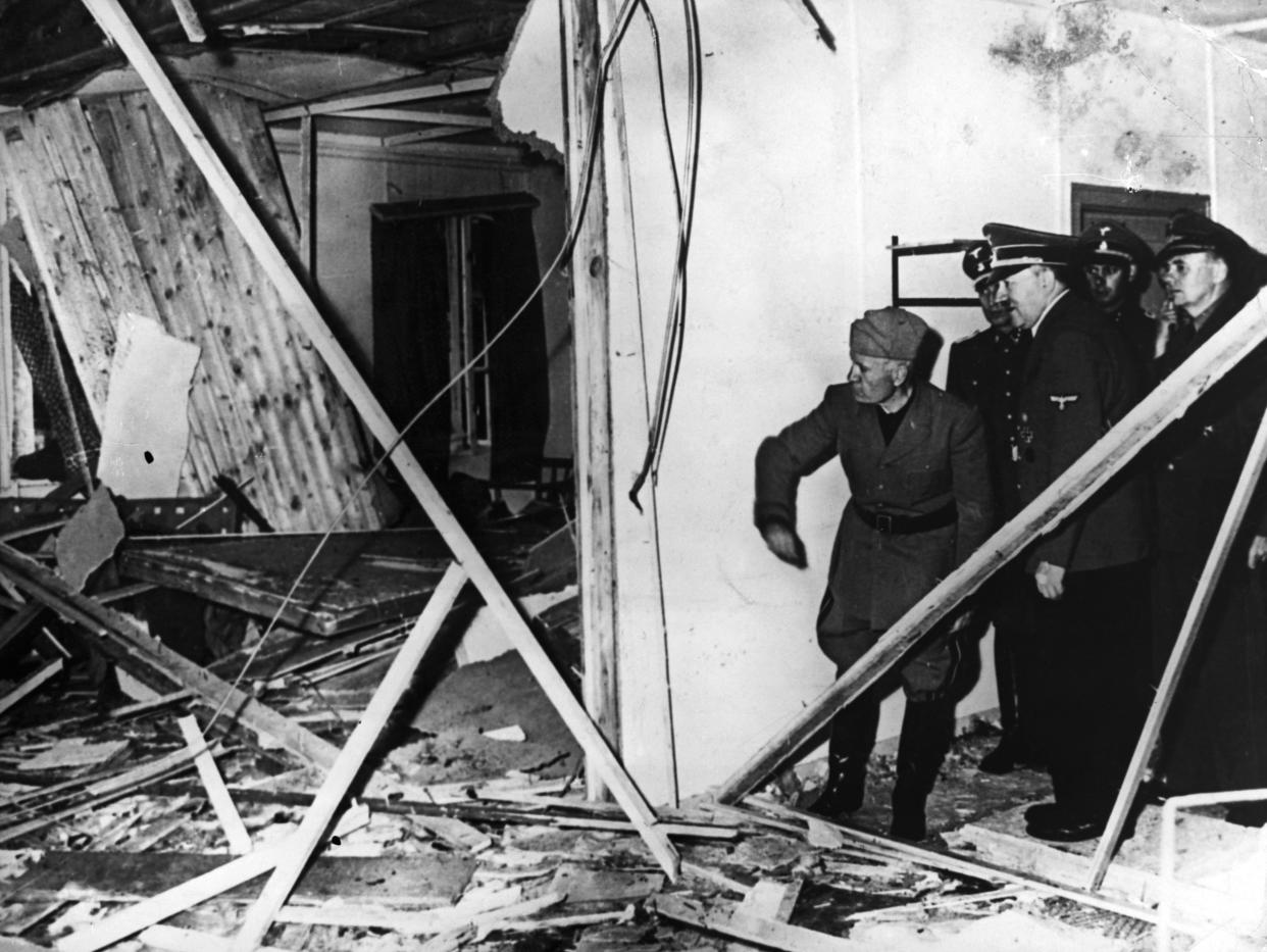 Adolf Hitler and Benito Mussolini visit Hitler's damaged headquarters in East Prussia after an attempt on Hitler's life there.