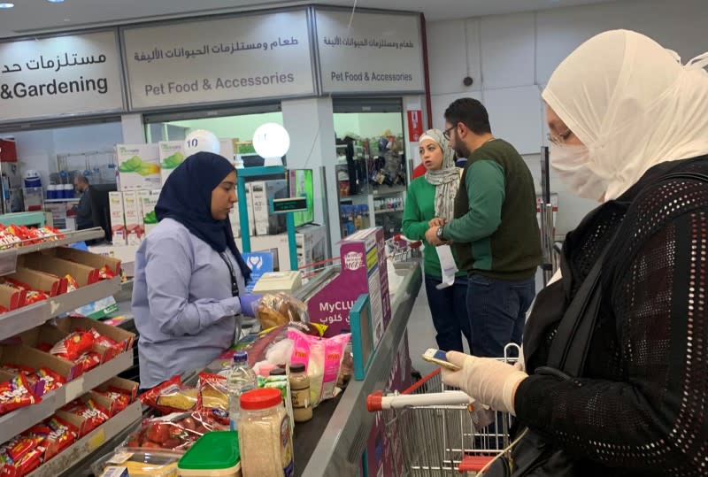 A woman wears a protective face mask inside a Carrefour hypermarket while Egypt ramps up its efforts to slow the spread the coronavirus disease (COVID-19) in Cairo