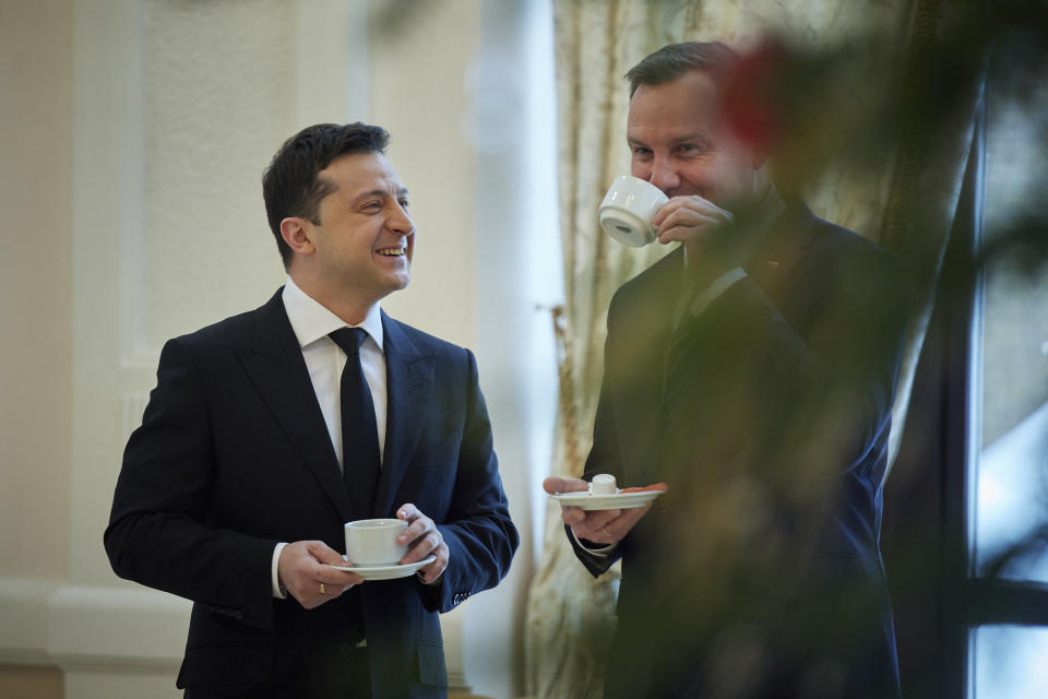 Ukrainian President Volodymyr Zelenskyy, left, and Poland's President Andrzej Duda talk during their meeting at the presidential residence in Ivano-Frankivsk region, 430 kilometers (270 miles) southwest of the capital, Kyiv, Monday, Dec. 20, 2021. (Ukrainian Presidential Press Office via AP)