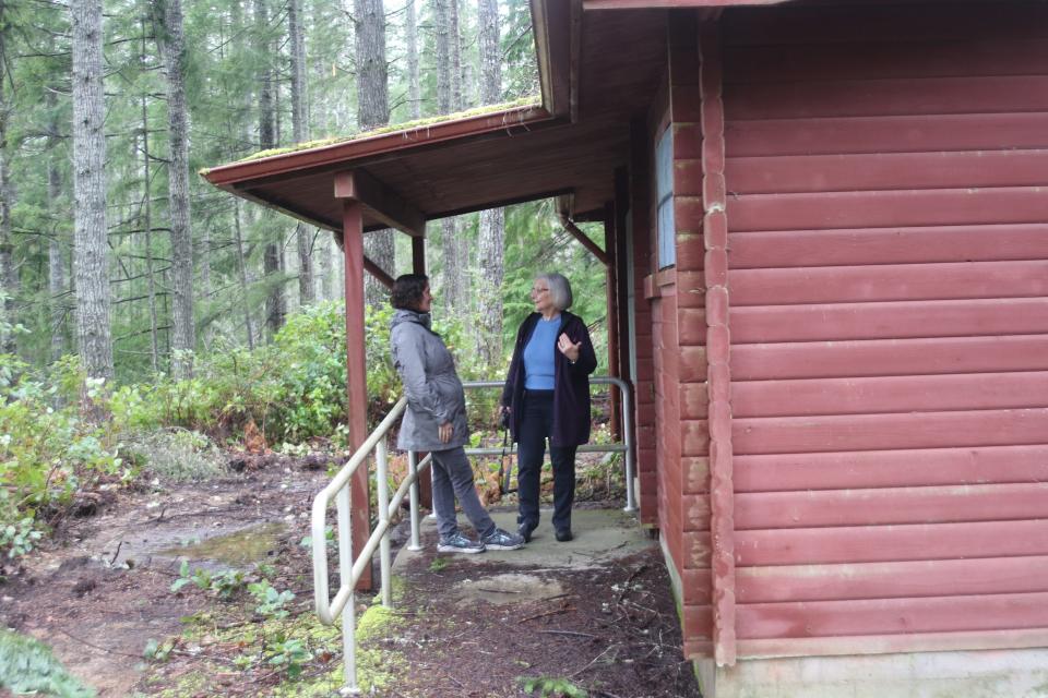 Kitsap County Commission Charlotte Garrido (right) on a tour of Camp Calvinwood with Kirsten Jewell (left), Kitsap's housing and homeless manager, in January 2020.  The shuttered Camp Calvinwood is now being considered as a site for a tiny homes village.