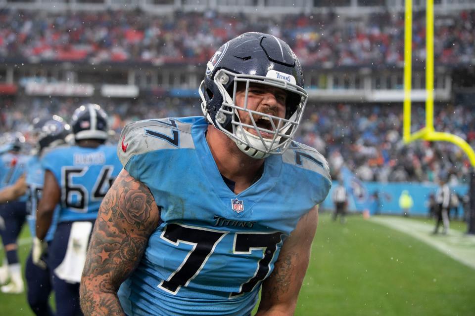 Tennessee Titans offensive tackle Taylor Lewan (77) celebrates as they defeat the Miami Dolphins 34 to 3 at Nissan Stadium Sunday, Jan. 2, 2022 in Nashville, Tenn. 