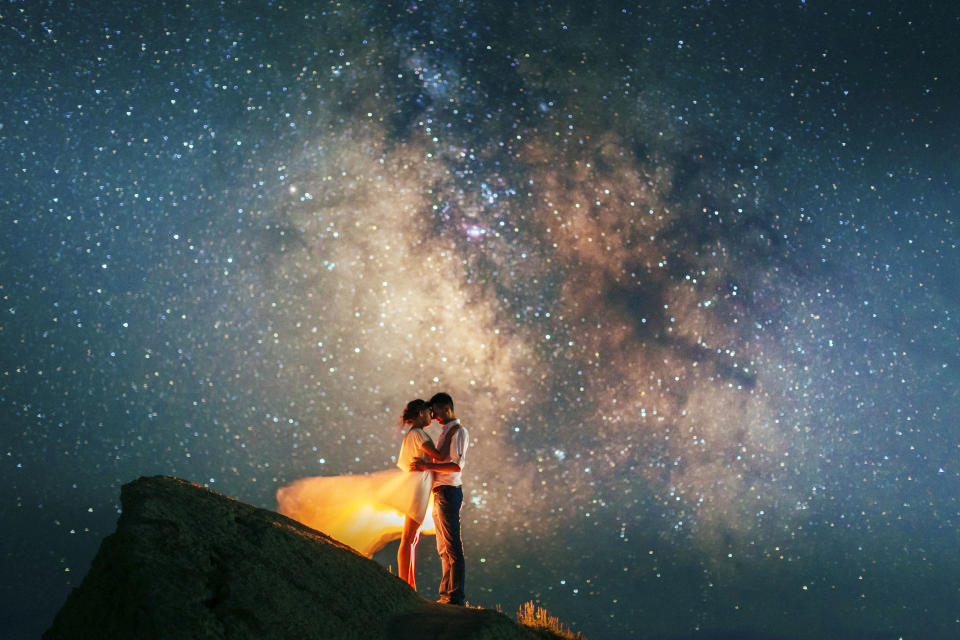 Stunning photos show couples silhouetted against night sky