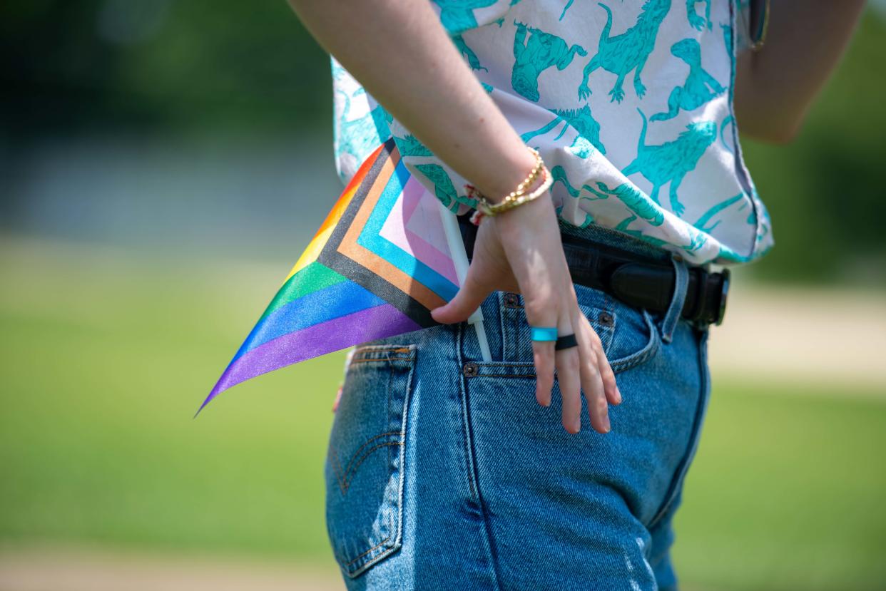 Charlee Vaultonburg sports a pride flag in their pockets during the Community Pride Month Celebration at Pugh Bourne Park on Sunday, June 24, 2023.