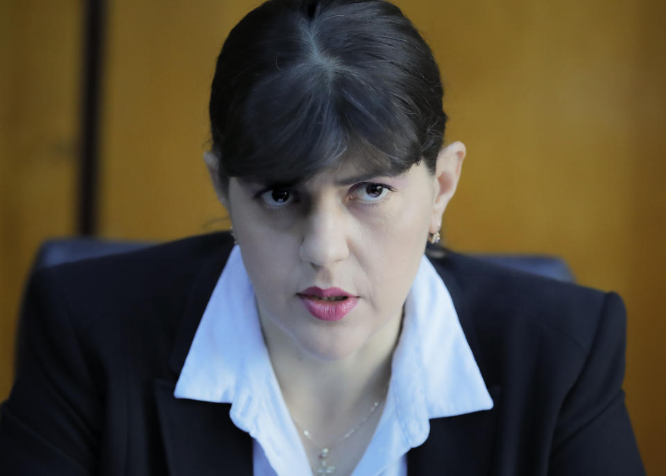 In this photo taken on Friday, Oct. 4, 2019, Laura Codruta Kovesi, Romania's former chief anti-corruption prosecutor who will direct the European Public Prosecutor's Office (EPPO) - tasked with investigating fraud connected to the use of EU funds and other financial crimes, speaks during an interview with the Associated Press, in Bucharest, Romania. For Kovesi, opposition to her successful candidacy to become the European Union’s first chief prosecutor came from a familiar source - her own country’s government. Kovesi spent five years as head of the Romanian Anticorruption Directorate and those indicted by her office included 14 Cabinet members, 53 lawmakers and a member of the European Parliament. (AP Photo/Vadim Ghirda)