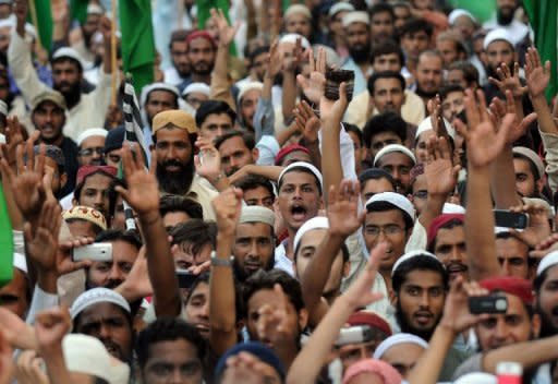 Pakistani Sunni Muslim protesters shout anti-US slogans during a rally against an anti-Islam movie in Karachi. Thousands of people rallied across Pakistan on Sunday to denounce an anti-Islam film with protestors burning US flags and effigies of President Barack Obama, and calling to sever ties with Washington