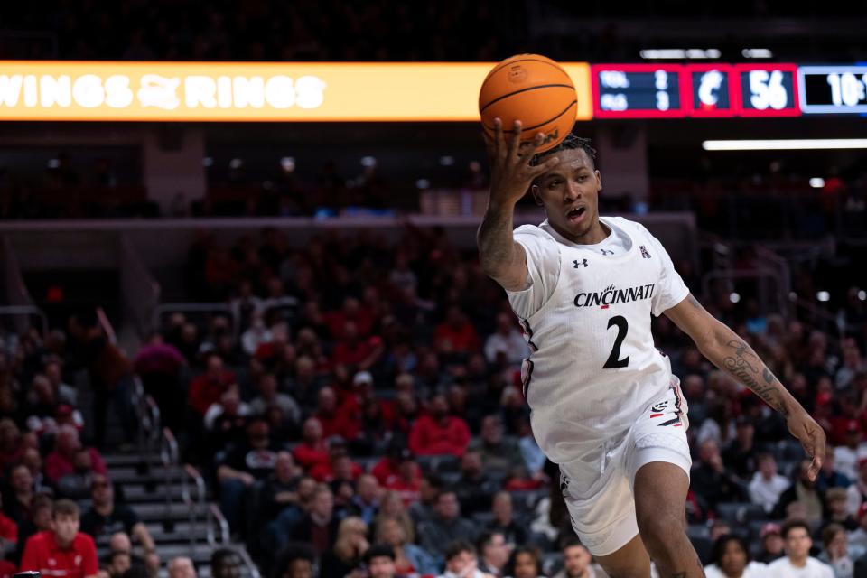 Bearcats guard Landers Nolley II (2) saves the ball in the second half of the Bearcats' 81-55 victory over Tulsa  at Fifth Third Arena Wednesday night. Nolley is averaging 15.7 points per game.