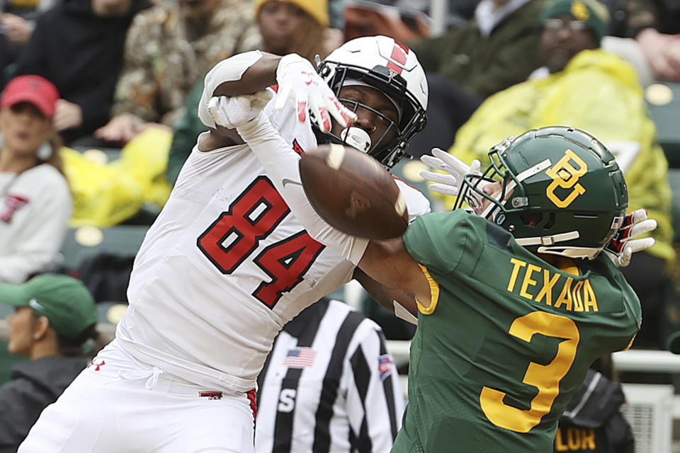 Baylor cornerback Raleigh Texada breaks up a pass in the end zone intended for Texas Tech wide receiver J.J. Sparkman in the first half of an NCAA college football game Saturday, Nov. 27, 2021, in Waco, Texas. (AP Photo/Jerry Larson)