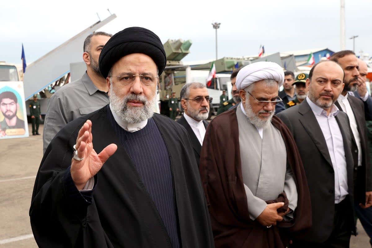 Iranian President Ebrahim Raisi (left) visiting the Iranian Revolutionary Guards Corps (IRGC) navy base in Bandar Abbas (Iranian Presidency/AFP via Getty)