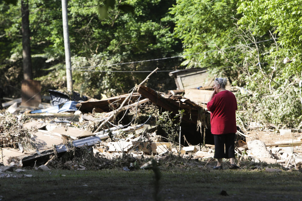 Emma Allen, 58, looks at the remnants of her damaged home after flooding in Falling Rock, West Virginia. (Photo: Marcus Constantino / Reuters)