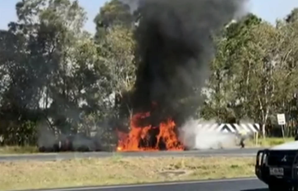 A police patrol car engulfed in flames, which quickly spread to the suspect’s car. Source: 7 News