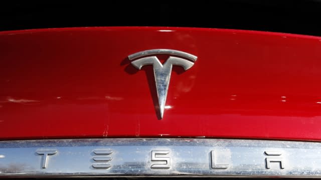 Tesla's logo is shown on a vehicle.