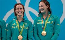 The girls smile after taking out gold in the final of the women's 4 x 100m freestyle relay on Day 1 of the Rio 2016 Olympic Games. Photo: Getty