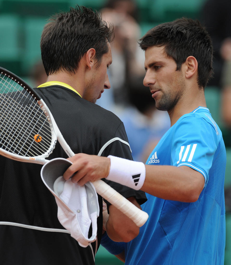 Novak Djokovic (pictured right) shakes hands with Ukraine tennis player Sergiy Stakhovsky (pictured left) during the French Open.