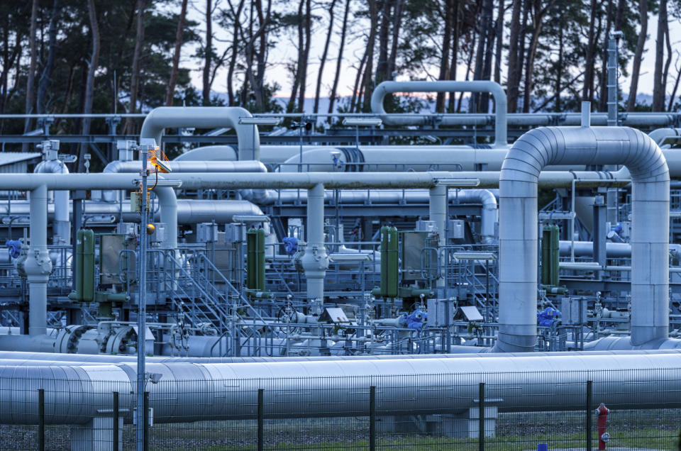 The pipe systems and shut-off devices at the gas receiving station of the Nord Stream 1 Baltic Sea pipeline and the transfer station of the OPAL gas pipeline, Baltic Sea Pipeline Link, light by the rising sun in Lubmin, Germany, Monday, July 11, 2022. The Nord Stream 1 pipeline, Germany’s main source of Russian gas, is scheduled to be out of action until July 21, 2022, for routine work. The operator said the gas flow was reduced progressively starting at 6 a.m. ( Jens Buettner/dpa via AP)