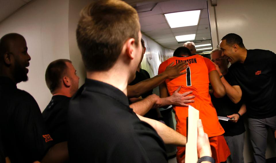 Oklahoma State's Bryce Thompson (1) is congratulated by team staff after defeating Baylor 61-54 at the Ferrell Center on Saturday.