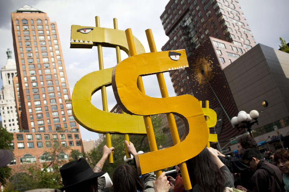 Occupy Wall Street demonstrators protest against the rising national student debt in Union Square, in New York, April 25, 2012. The protest eventually marched to Wall Street; two people were arrested during the protest. REUTERS/Andrew Burton (UNITED STATES - Tags: CIVIL UNREST EDUCATION)