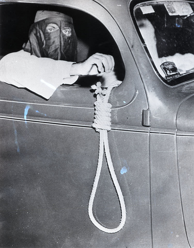 Member of the Ku Klux Klan staged an automobile parade through the Black section of Miami on the eve of an election