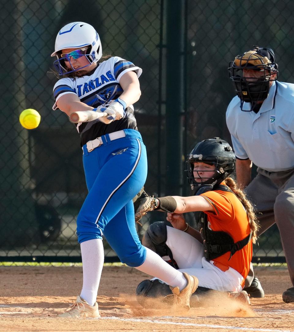 Matanzas Leah Stevens line drives to third base during game with University at University High School in Orange City, Thursday, March 14, 2024.