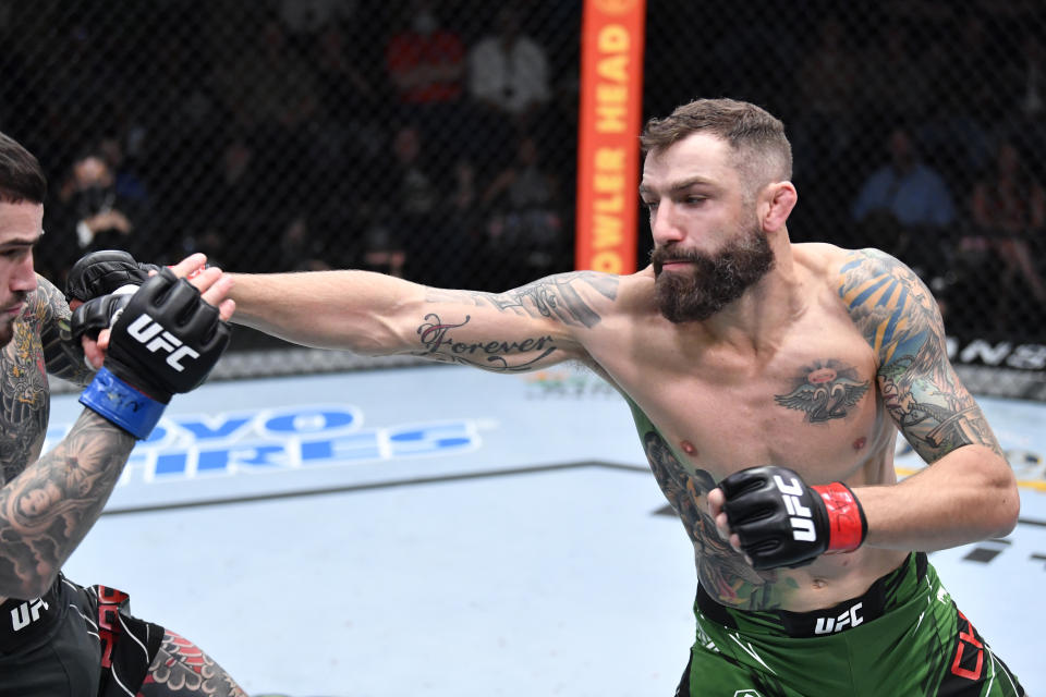 LAS VEGAS, NEVADA – NOVEMBER 20: (R-L) Michael Chiesa punches Sean Brady in a welterweight fight during the UFC Fight Night event at UFC APEX on November 20, 2021 in Las Vegas, Nevada. (Photo by Chris Unger/Zuffa LLC)