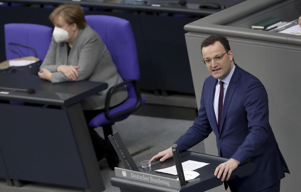 File - In this Wednesday, Jan. 13, 2021 file photo German Chancellor Angela Merkel listen to German Health Minister Jens Spahn holding a speech on the current developments of the new coronavirus pandemic in Germany at a meeting of the parliament, Bundestag, in Berlin, Germany.German Chancellor Angela Merkel's center-right party, the Christian Democratic Union, CDU, is choosing a new leader on the weekend Saturday Jan. 16 and Sunday Jan. 17, 2021, a decision that will help determine who succeeds Merkel at the helm of the European Union's biggest economy after a 16-year reign. (AP Photo/Michael Sohn, file)