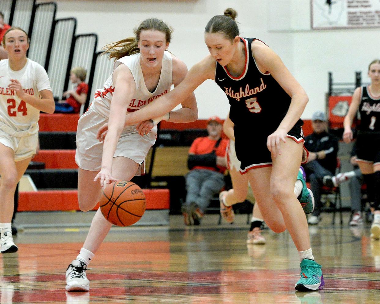 Chatham Glenwood's Alexis Neumann scoops up a loose ball during the Class 3A Highland Supersectional game against Highland on Monday, February 26, 2024.