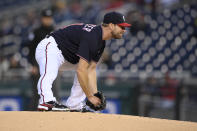 Washington Nationals starting pitcher Max Scherzer stretches on the mound during the first inning of the team's baseball game against the San Francisco Giants, Friday, June 11, 2021, in Washington. Scherzer left the game with an injury. (AP Photo/Nick Wass)