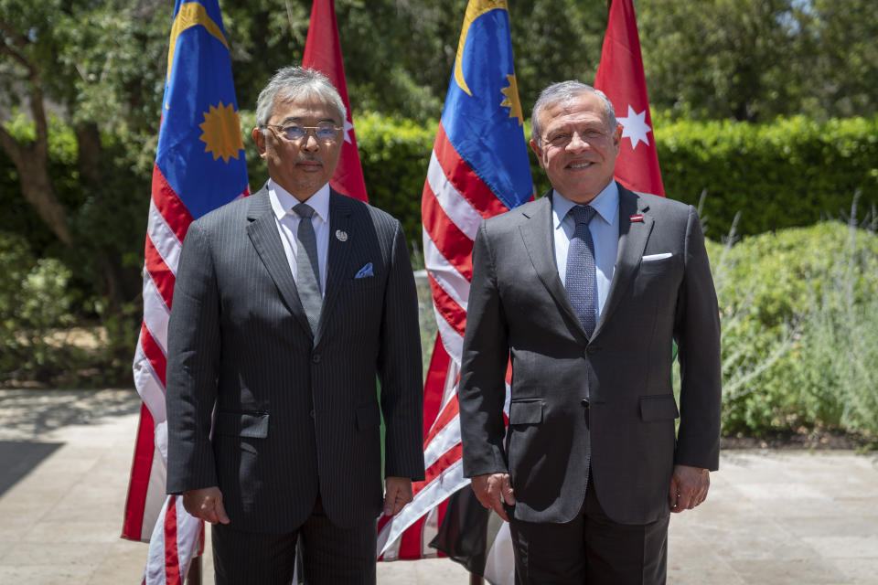 Jordan's King Abdullah II, left, poses for a photo with Malaysia's King Sultan Abdullah Sultan Ahmad Shah in Amman, Wednesday, May 31, 2023, a day ahead of the wedding of Crown Prince Al Hussein bin Abdullah II and Rajwa Alseif. (Royal Hashemite Court via AP)