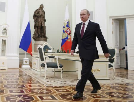 Russian President Vladimir Putin attends a meeting with his Moldovan counterpart Igor Dodon at the Kremlin in Moscow, Russia, January 17, 2017. REUTERS/Sergei Ilnitsky/Pool