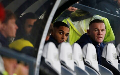 Soccer Football - Championship - Derby County v Queens Park Rangers - Pride Park, Derby, Britain - November 30, 2019 Derby County player coach Wayne Rooney watches the match from the bench  - Credit: Action Images via Reuters